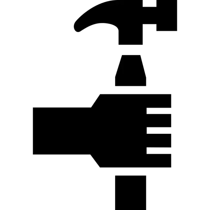 Hand holding a hammer