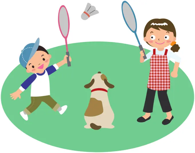 Mother plays badminton with son and dog