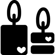 Couple of romantic candles burning with hearts symbols